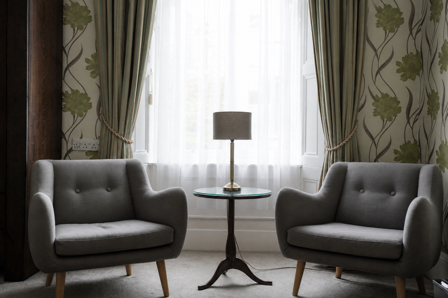 Seating area beside a bright window at Gladstone House